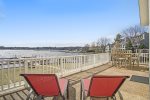Expansive balcony overlooking the Saugatuck Harbor including holiday fireworks